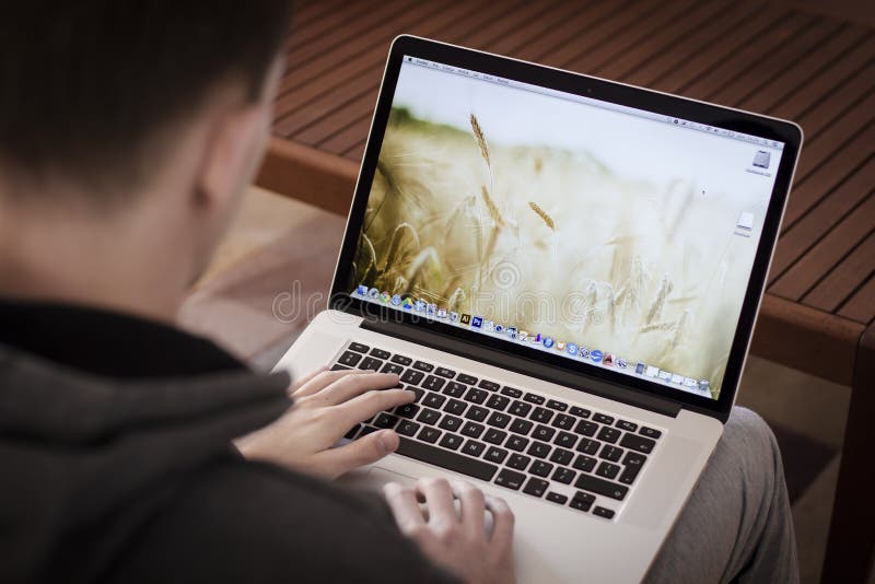 Man using Macbook pro retina. Man using Macbook pro retina.